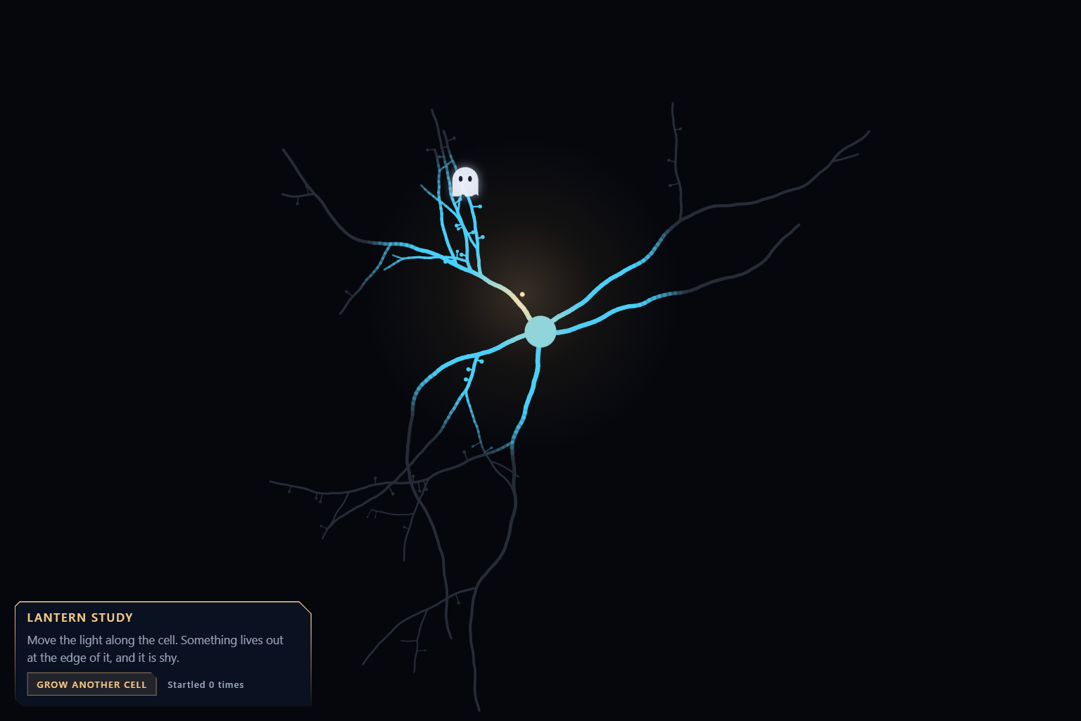 A branching cell on a near black ground, blue where a soft warm light falls on it and grey elsewhere, with a small white ghost at the upper edge of the light.